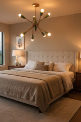 Closeup of compact Sputnik chandelier showing glossy mint green shades, solid brass detailing, and exposed bulb design