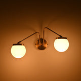 Contemporary double globe wall lamp with sculptural form for stylish bedrooms, hallways, living rooms, and interiors