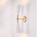 Copenhagen double cone wall sconce shown in restaurant interior with warm up and down lighting effect