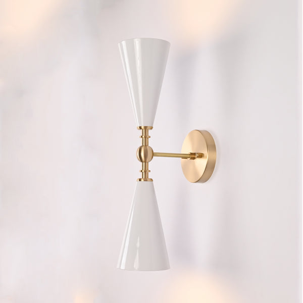 Copenhagen double cone wall sconce shown in restaurant interior with warm up and down lighting effect
