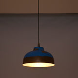 Multiple blue copper pendant lights arranged above a kitchen island for stylish task lighting