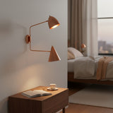 Copper patina wall sconce with movable brass arms, dome shade, cone shade, and sculptural mid century design