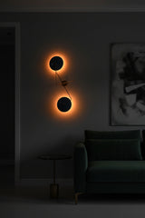 Custom blue disc wall light fixture with solid brass arms, round canopy, and sculptural modern statement design