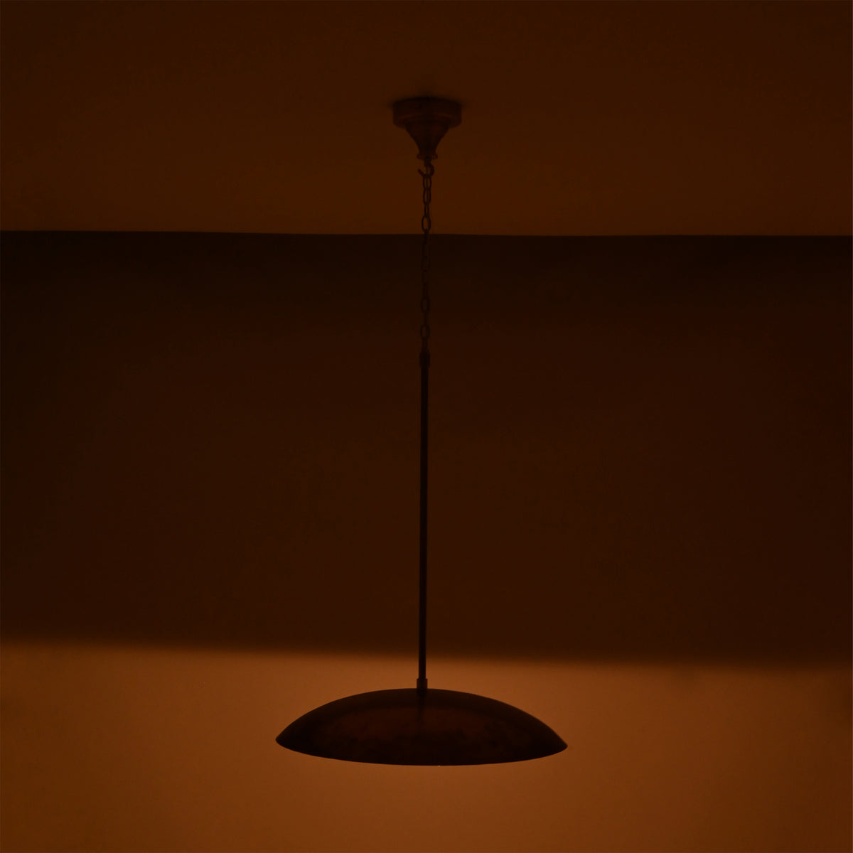 Custom brass pendant light ceiling fixture with adjustable drop length, elegant dome shade, and warm focused glow