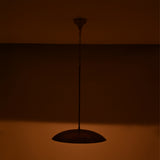 Custom brass pendant light ceiling fixture with adjustable drop length, elegant dome shade, and warm focused glow
