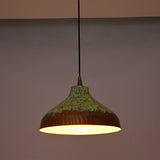 Custom copper pendant light with black cord, copper canopy, and green patina dome shade for modern rustic interiors