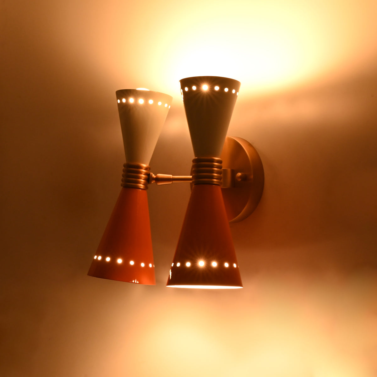 Custom painted diabolo wall fixture with solid brass shades and adjustable color options