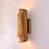 Customizable brass up down wall sconce with hardwired installation and warm architectural glow
