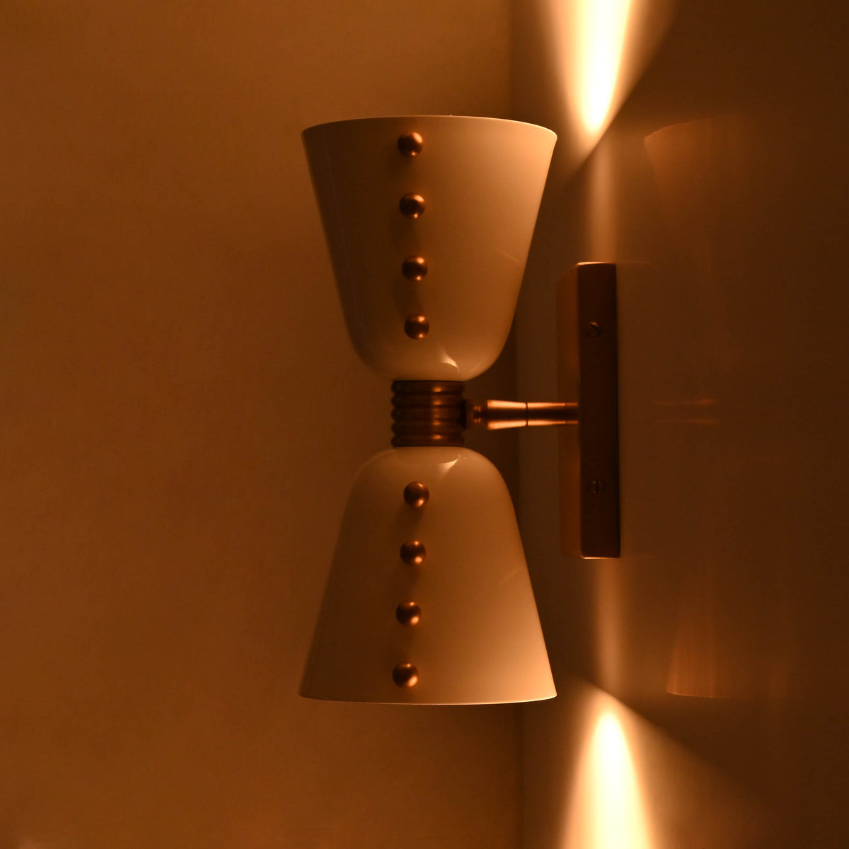 Customizable diabolo wall sconce for bathrooms, bedrooms, powder rooms, cafés, and boutique hotels