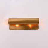 Customizable linear up down wall light with solid brass construction and warm ambient lighting effect
