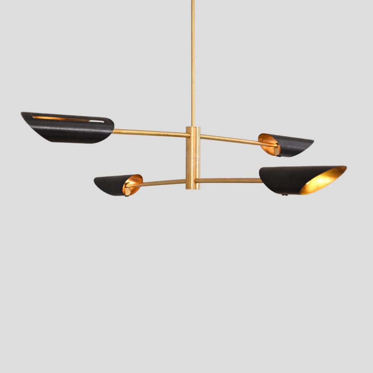 Customizable modern brass chandelier with black and gold bowl shades, elegant pendant lighting for contemporary interiors.
