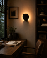 Customizable petal wall sconce with solid brass construction, hidden rear lighting, and dramatic silhouette