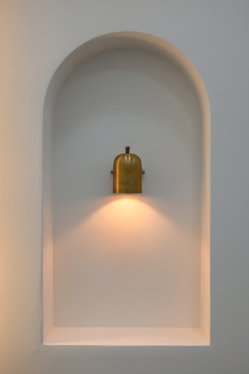 Cylindrical hallway wall light producing a soft downward pool of warm light for corridors and entryways