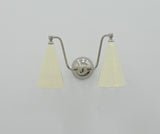 Double cone wall light with two ivory shades, polished chrome arms and balanced downward illumination