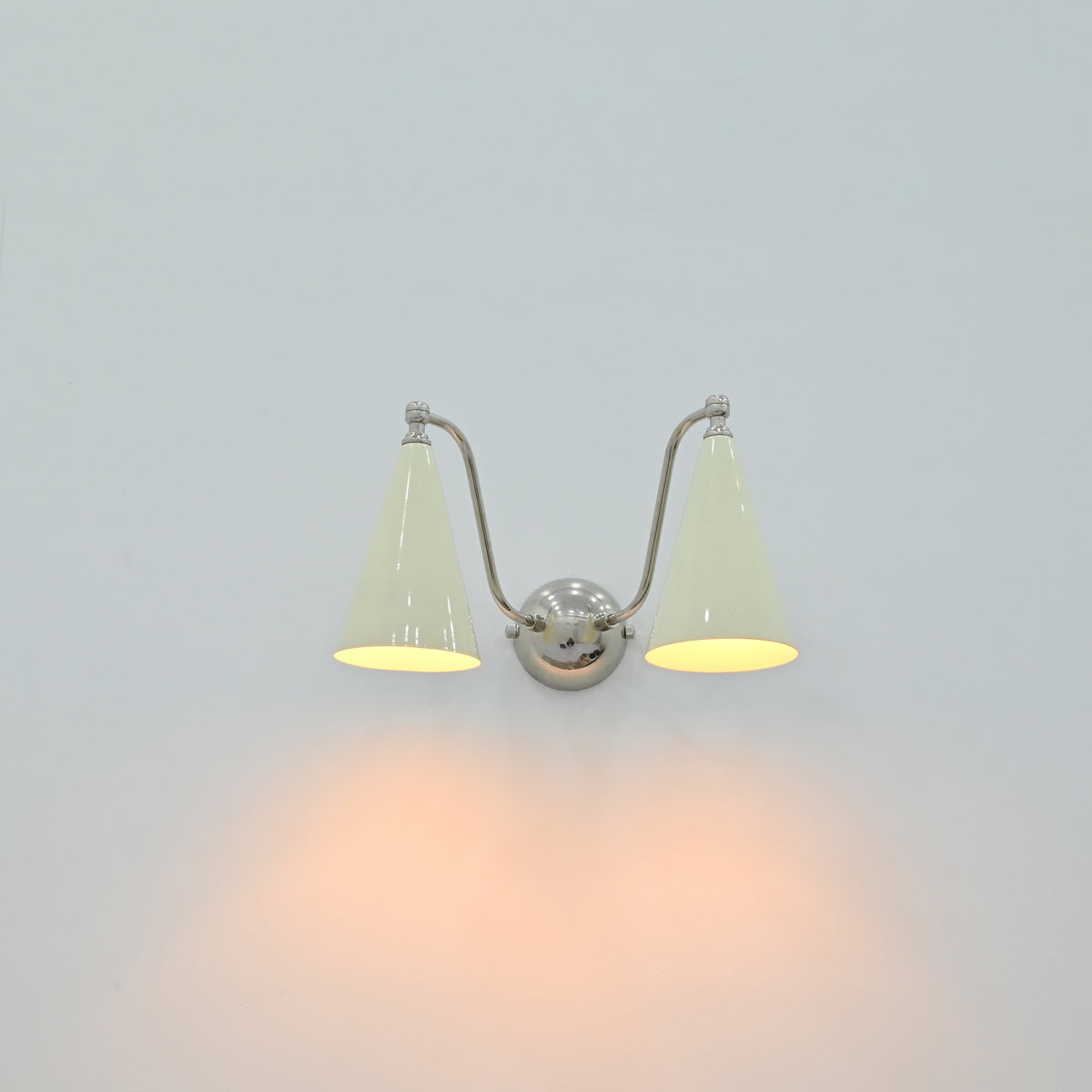 Double wall light with ivory cone shades and chrome finish for vanity, dressing area or powder room