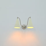 Double wall light with ivory cone shades and chrome finish for vanity, dressing area or powder room