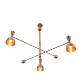 Bottom view of Diabolo mid-century brass chandelier showing intersecting arms and warm interior glow from bowl-shaped shades.
