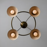 Bottom view of Diabolo brass chandelier highlighting symmetrical cone shade arrangement and soft glowing bulbs