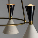 Close-up of Diabolo style chandelier showing black cone shades paired with brass arms and precision craftsmanship