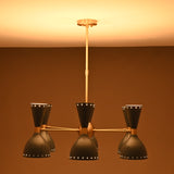 Front view of mid-century dual-cone brass chandelier with soft warm lighting.