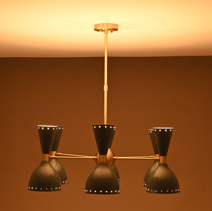 Front view of mid-century dual-cone brass chandelier with soft warm lighting.