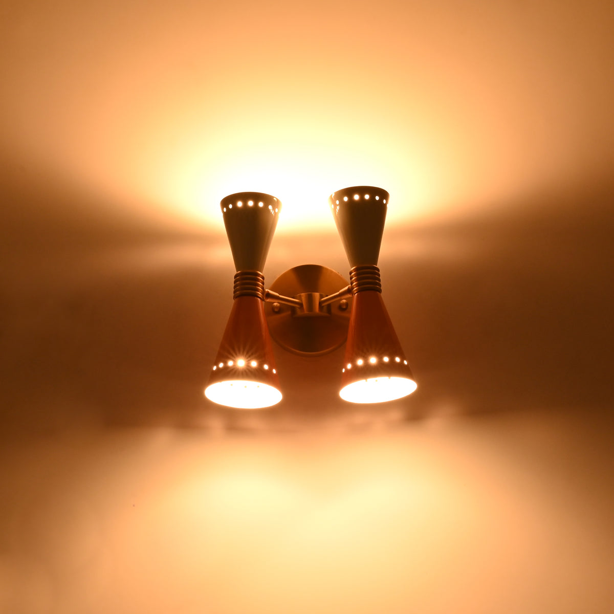 Dual diabolo wall sconce dimension view showing 10 inch height and 10 inch width