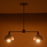 Two-light modern ceiling fixture in brushed brass and white dome shades, handcrafted for warm ambient lighting