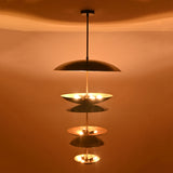Close-up illuminated view of Eclipse Cascade Chandelier showcasing sculptural multi-tier dish shades