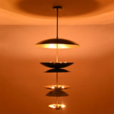 Full view of illuminated Eclipse Cascade Chandelier creating elegant layered ambient illumination