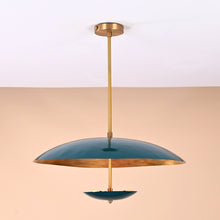 Front view of handcrafted emerald green brass chandelier with golden interior finish and elegant dual-bowl silhouette