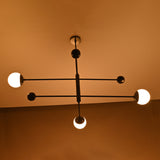 Softly lit chandelier casting warm glow in cozy interior