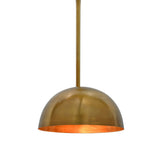 Extended arm brass wall light with curved bowl shade creating focused warm light for bedrooms, hallways, and living rooms