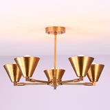Ceiling-mounted five-light brushed brass chandelier with balanced arms and cone-shaped shades.