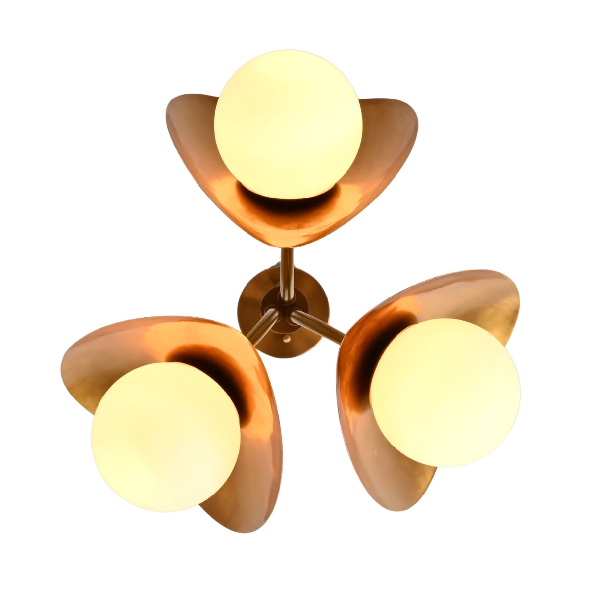 Floral globe ceiling light installed in a luxury living room with warm ambient glow and elegant brass petal form