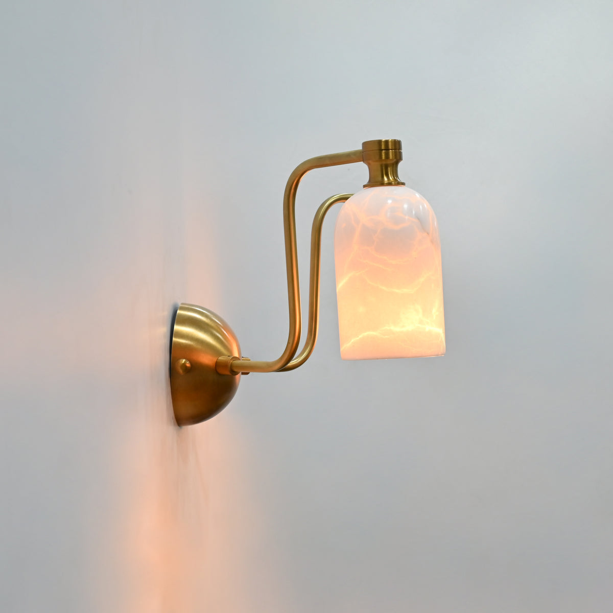 Florence two light brass wall sconce featuring symmetrical arms, alabaster shades, and refined decorative style