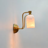 Florence two light brass wall sconce featuring symmetrical arms, alabaster shades, and refined decorative style