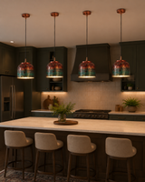 Four copper pendant lights with multicolor textured shades installed above a kitchen counter for warm task lighting