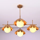 Angled view of four-light brushed brass chandelier highlighting sculpted shade details and craftsmanship.