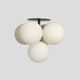 Modern globe cluster chandelier with five frosted glass spheres – handmade brass ceiling light in minimalist design