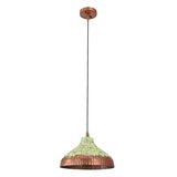 Green patina copper pendant light styled above a dining table with warm ambient glow and cozy room atmosphere