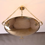 Handcrafted brass bowl chandelier with ornate sculpted handles and chain suspension