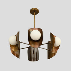 Handcrafted brass ceiling chandelier with brushed finish, three frosted glass globes, and sculptural bowl-shaped shades.