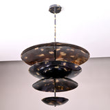 Handcrafted multi-tier brass chandelier with four sculpted bowl-shaped discs in a modern design