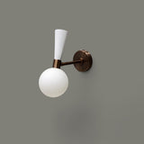 Handcrafted brass and white globe wall light with minimalist design and opal glass shade