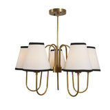 Handcrafted 5 Light Brass Chandelier with cream fabric shades, black trim, and brushed brass finish for refined interiors