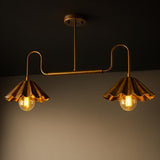 Handmade solid brass 2-light disc chandelier with curved arms and scalloped brass shades glowing with warm light