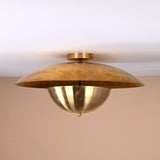 Handmade brass disc flush mount light featuring dual bowl structure with polished brass finish for modern interiors