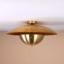 Handmade brass disc flush mount light featuring dual bowl structure with polished brass finish for modern interiors