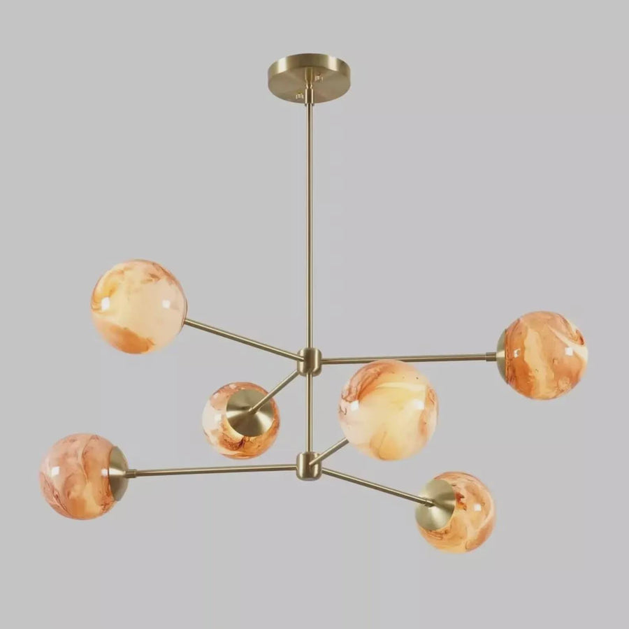 Handmade brass ceiling light with six marble glass globes, designed for living rooms and dining spaces with warm ambient illumination.