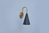Handmade solid brass wall light with matte black cone shade, elegant minimalist design by Brass Leaf Studio
